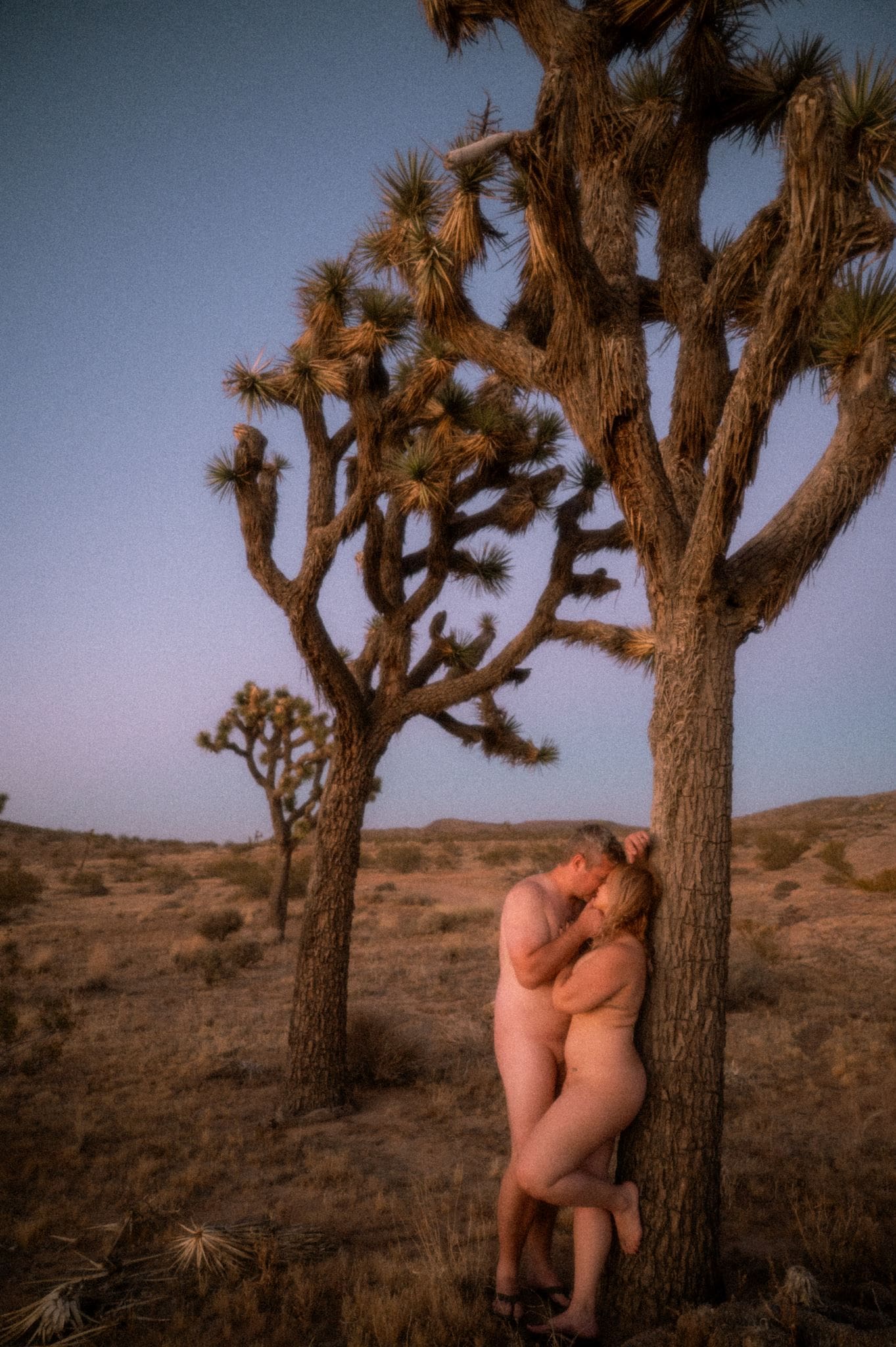 Couple sharing an affectionate moment in Joshua Tree